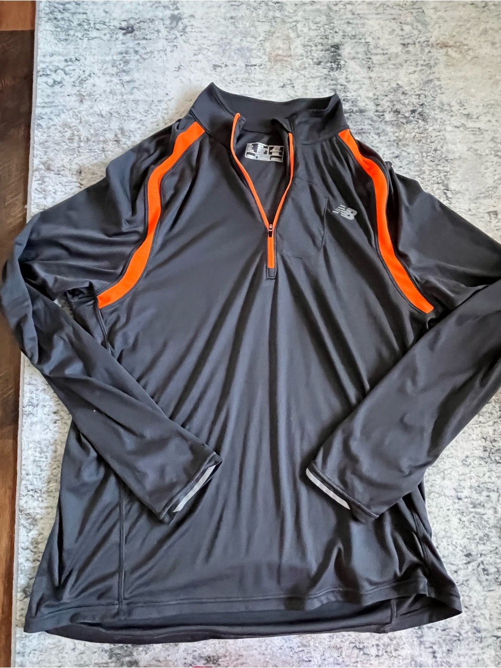 New Balance Men’s Black Quarter- Zip Pullover with Orange Accents